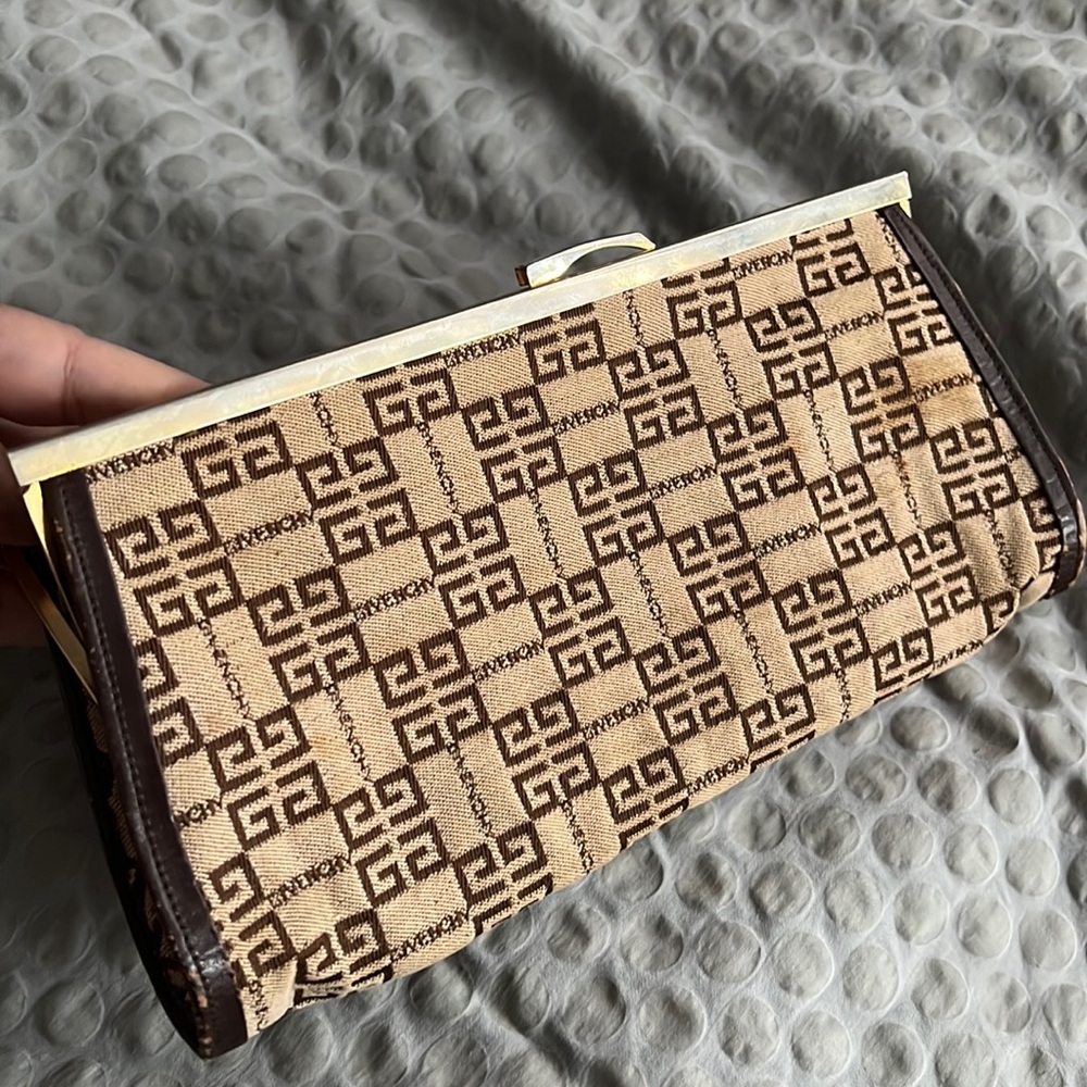 Original vintage Givenchy clutch. With logo pattern.